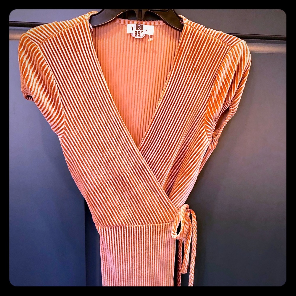 Shimmery, peachy, maxi-length wrap dress.